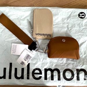 Lululemon dual pouch wristlet in Trench / Burnt Caramel / Black.
